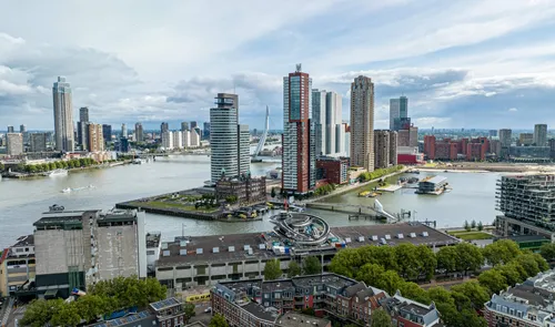 Aerial shot of Rijnhaven, with the new FENIX museum, the Wilhelminapier, the river Maas and the Erasmus bridge visible. Photo by Henry Verhorst.