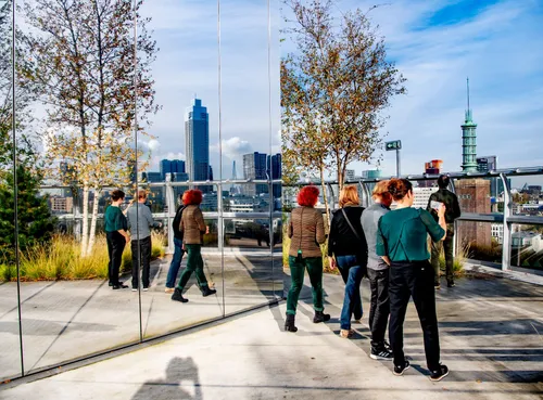 Photo: visitors enjoying the amazing view on Rotterdam from the Depot rooftop terrace