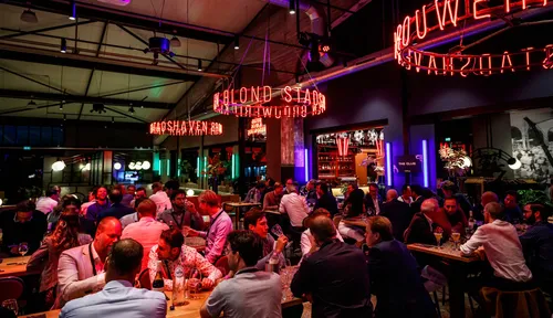 Photo: people enjoying themselve at a bar
