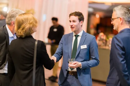 Photo taken during the 2024 edition of Rotterdam Partners' Red Carpet Dinner at de Doelen ICC Rotterdam. People are shaking hands.
