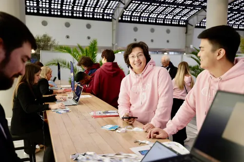 Photo of people interacting during registration for PCMA EMEA in Rotterdam