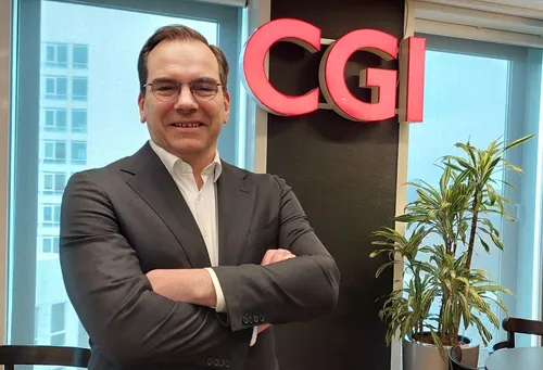 Photo of Joost van der Burgh of CGI, posing in the CGI office in Rotterdam.