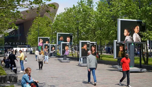 Photo: people walking past displays of the 2023 ESPCI congress