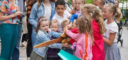 Photo of children at the opening of their improved schoolyard