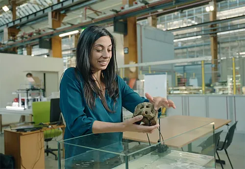 Photo of Nadia Fani, founder of Coastruction, holding a 3D printed artificial reef