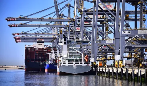 Photo of a container ship moored at a Rotterdam quay.