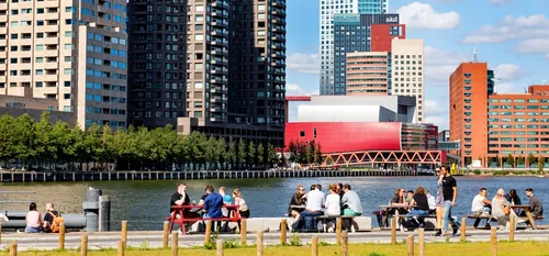 Photo: people enjoying the Fenix terrace and the view on Rijnhaven