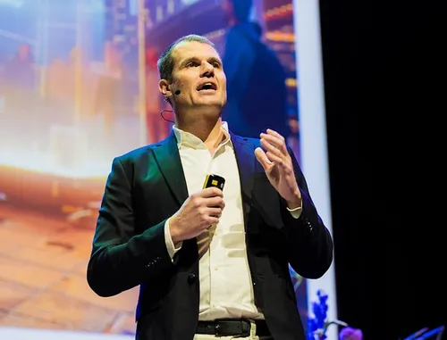 Photo of Tim Lee addressing the audience at InnovationQuarter's year event 2025.