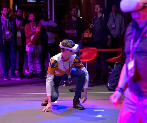 Photo of young man gaming in 3D environment during TwitchCon