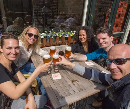 Photo of a group of people enjoying a drink during a Bike & Bite tour.