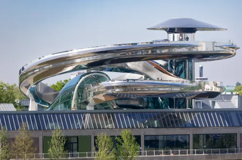 Fenix photographed from afar, a silver tornado in the sky.