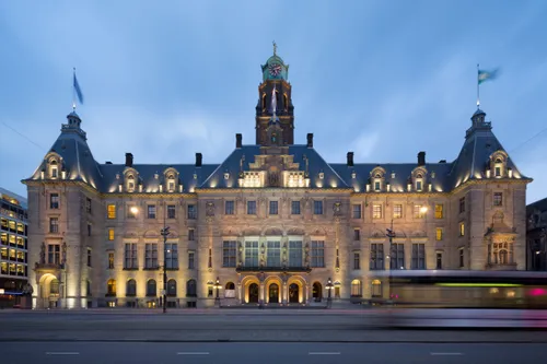 The city hall of Rotterdam, with a tram in the foreground.